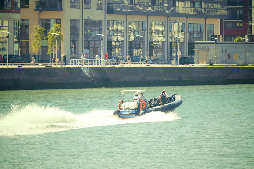 Rigid Inflatable Boat Speeding on Urban Waterway