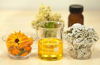 Natural herbal infused oil with calendula and yarrow flowers