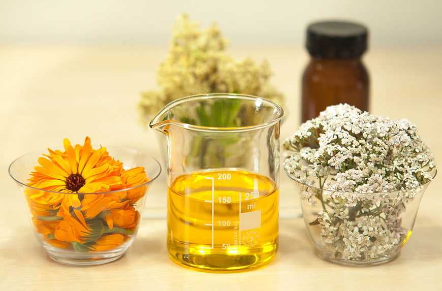 Natural herbal infused oil with calendula and yarrow flowers