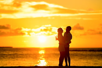 Romantic Couple Silhouette with Wine at Sunset Beach