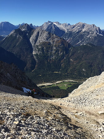 Hikers on Rocky Mountain Trail with Alpine Valley View