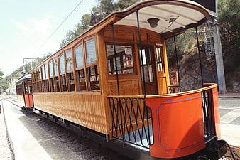 Vintage Wooden Funicular Train on Mountain Tracks