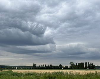 Dramatic Storm Clouds Over Rural Wheat Field Landscape
