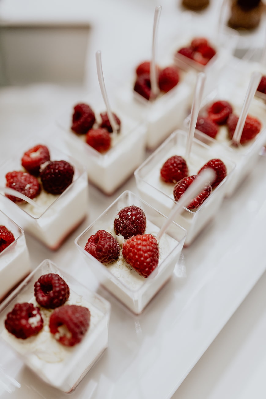 Raspberry cheesecake desserts in clear cups
