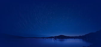 Star Trails Over Calm Harbor Night Sky