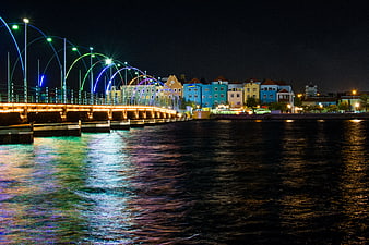 Colorful Pontjesbrug Bridge at Night with Water Reflections