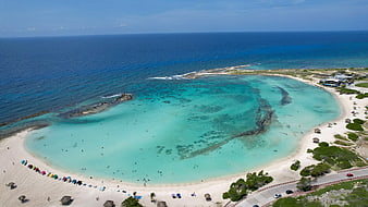 Aerial View of Turquoise Lagoon and White Sandy Beach