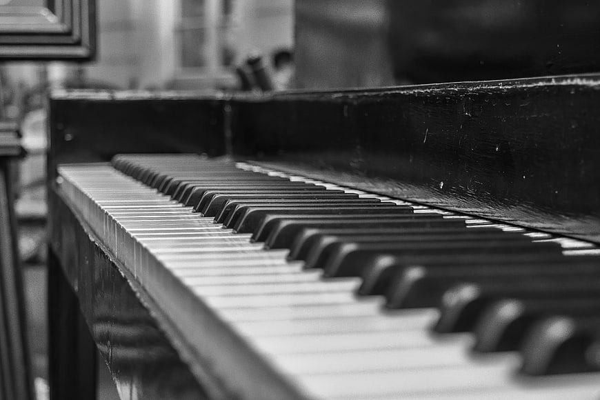 Close-up of vintage piano keys in black and white