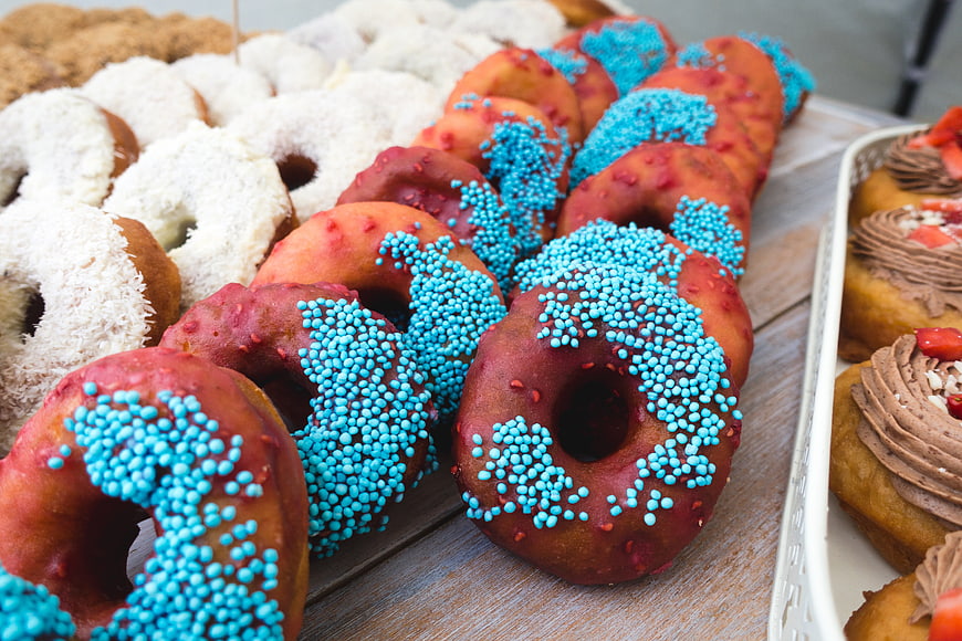 Colorful Donuts with Blue Sprinkles and Coconut