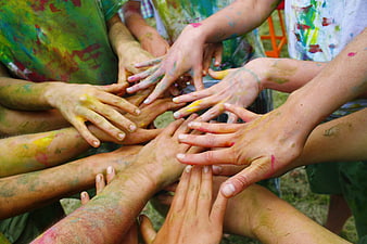 Colorful Hands Stacked Together in Unity and Teamwork