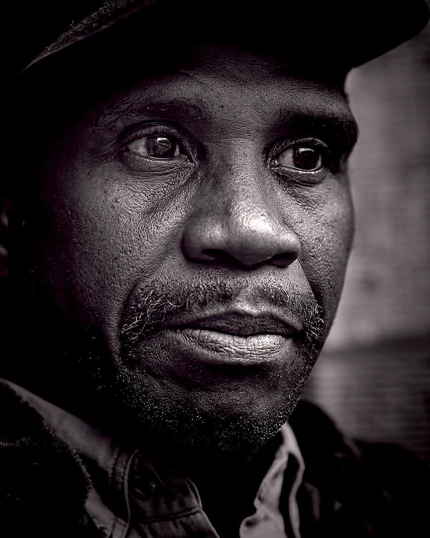 Black and white portrait of a man with a serious expression