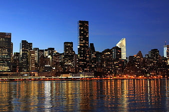 Manhattan Skyline at Dusk with River Reflections