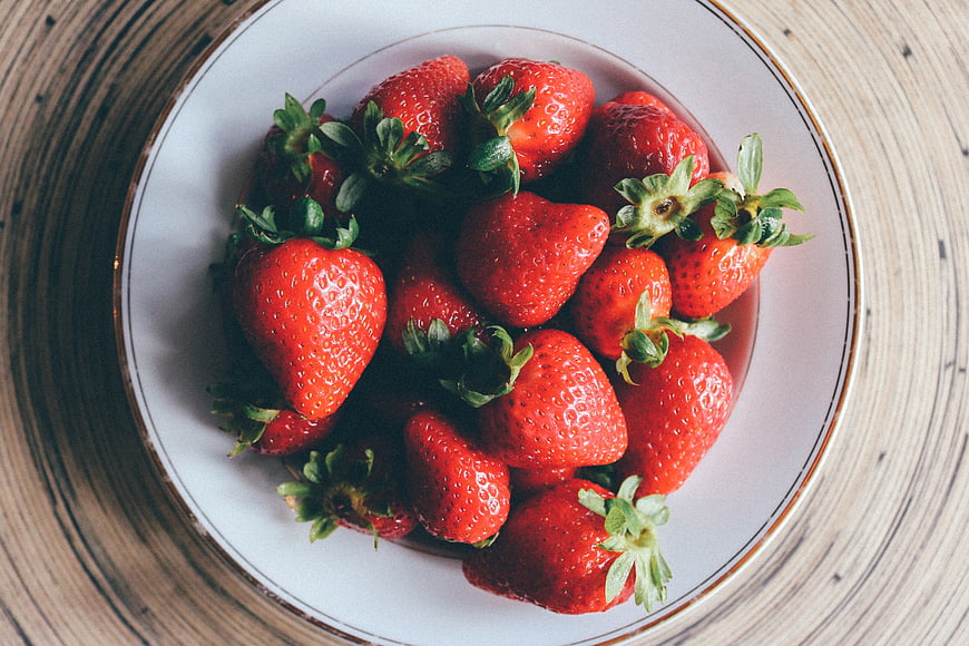 Fresh Red Strawberries in White Bowl on Wooden Table