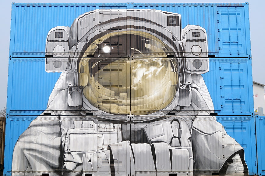 Astronaut Graffiti Mural on Blue Shipping Container