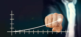 Businessman Drawing Growth Curve On Digital Screen