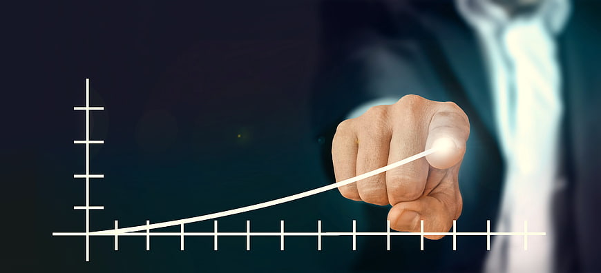 Businessman Drawing Growth Curve On Digital Screen