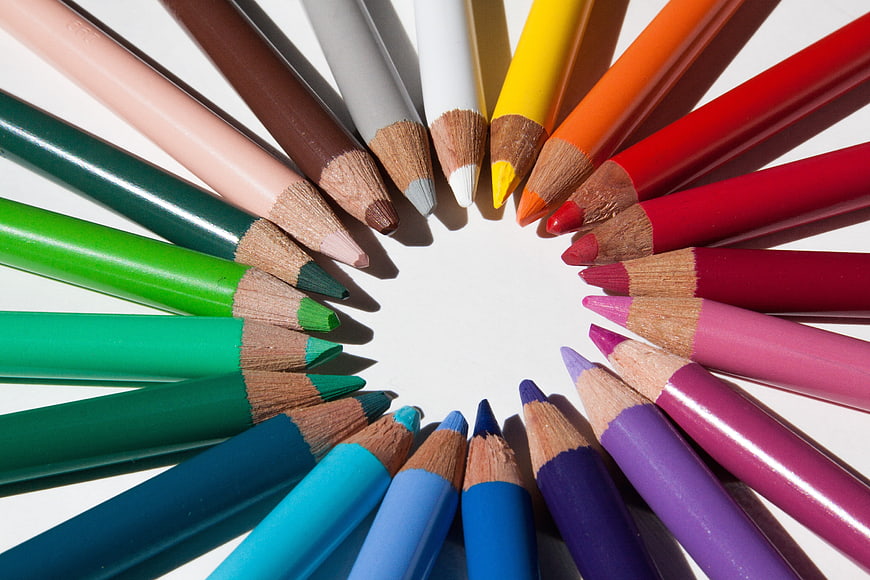 Colorful Pencils Arranged in a Circle on White Background