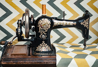 Vintage Jones Sewing Machine on Patterned Fabric
