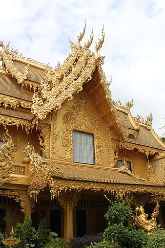 Golden Thai Temple Architecture with Intricate Roof Details