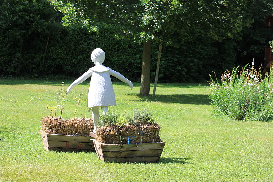 White Girl Statue in Wooden Garden Planters