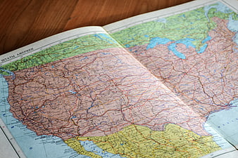 Vintage Atlas Map of North America on Wooden Table