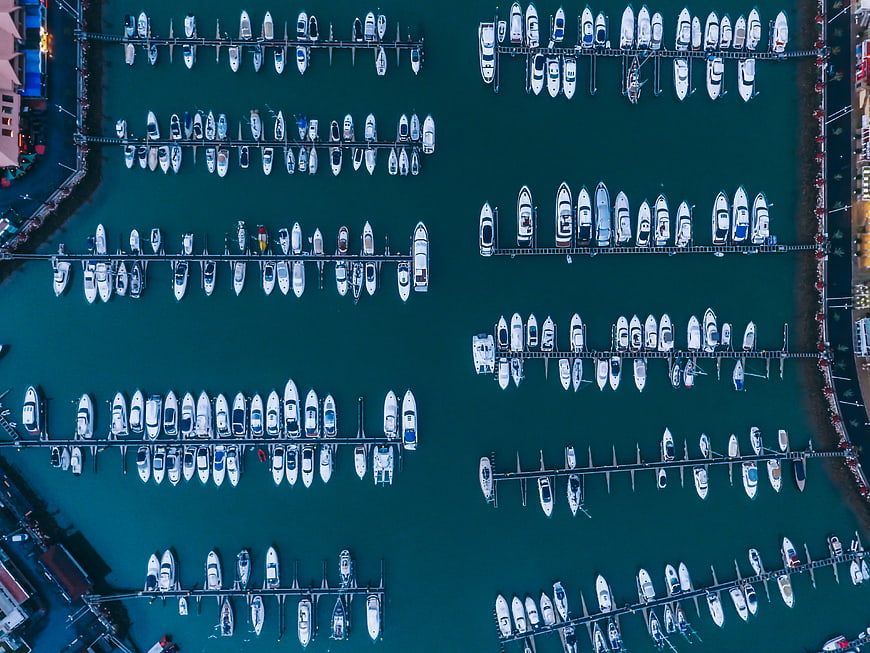 Aerial top view of marina with docked boats
