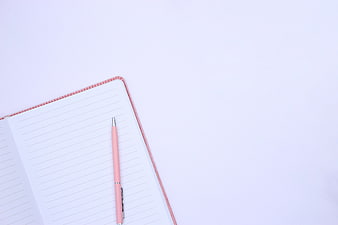 Pink Pen on Open Notebook with Blank Pages and Copy Space