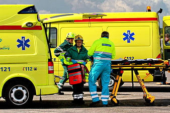 Emergency Medical Team Loading Ambulance Stretcher
