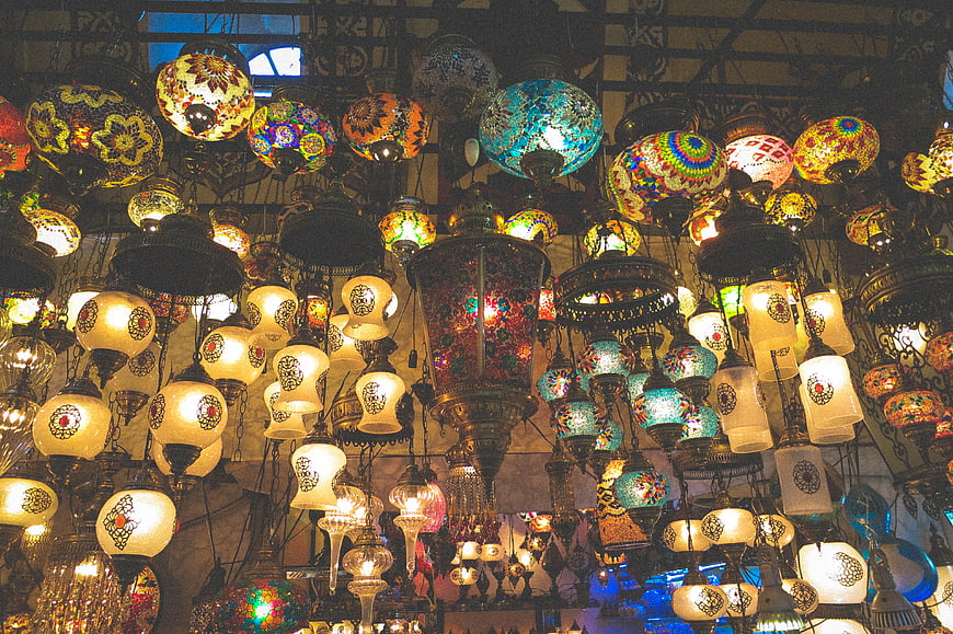 Colorful Turkish mosaic lamps hanging in a market shop