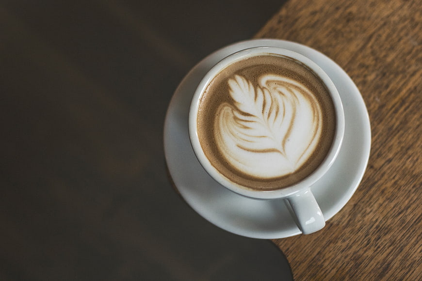 Top View of Latte Art Coffee on Wooden Table