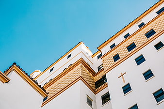 Low angle view of white church architecture with blue sky
