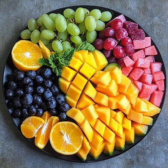 Colorful Fruit Platter with Mango, Grapes, and Watermelon