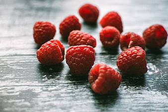 Fresh Raspberries on Dark Wooden Table
