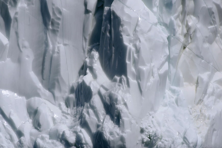 Close-up of jagged blue and white glacier ice texture