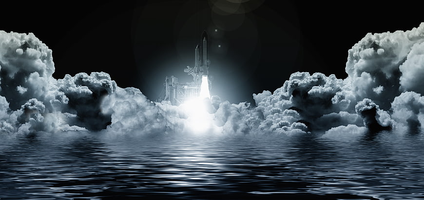 Space Shuttle Launching Through Clouds Over Water at Night