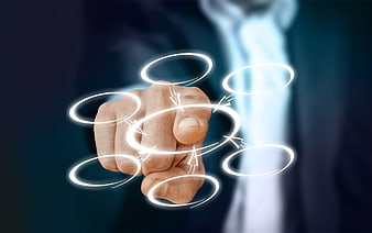 Businessman hand touching glowing digital network rings