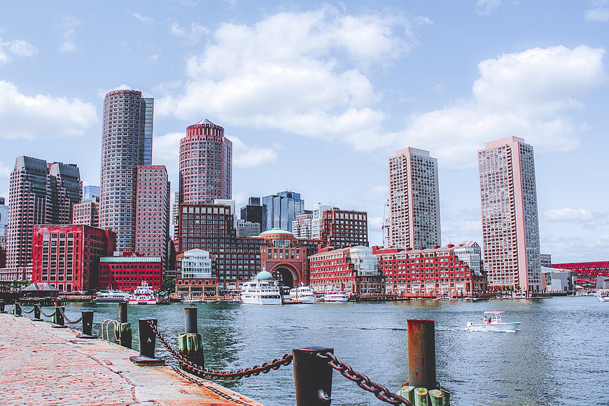 Boston Waterfront Skyline with Harbor Boats and Pier