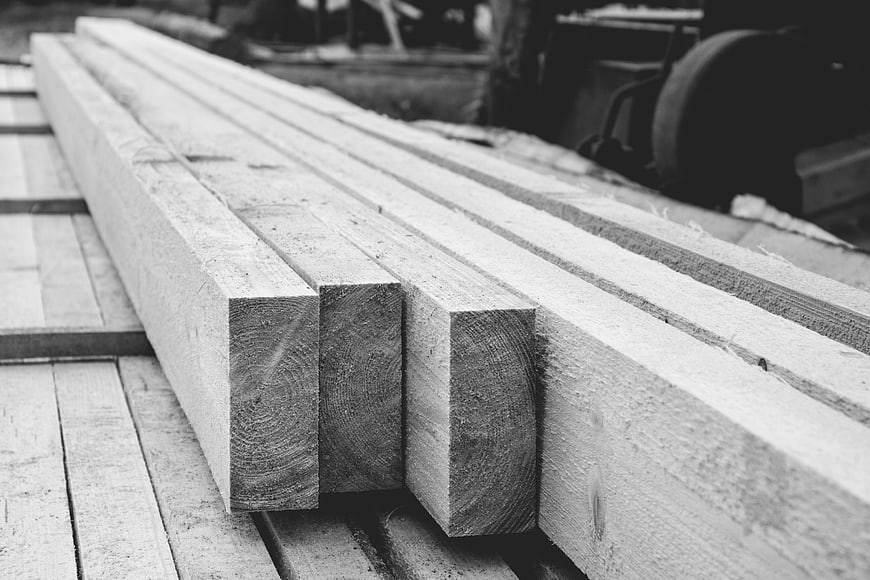 Black and white lumber planks with wood grain texture
