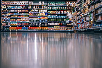 Supermarket Aisle With Colorful Shelves And Reflective Polished Floor
