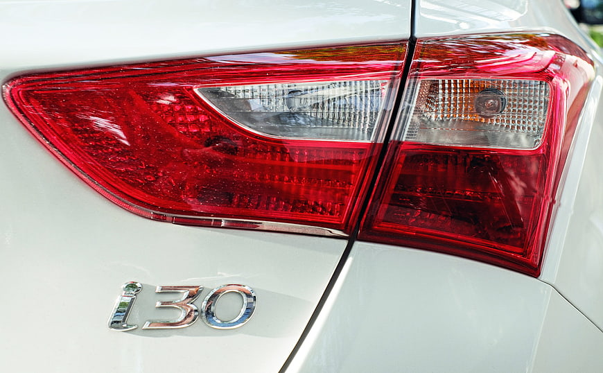 Close-up of Hyundai i30 rear taillight and badge on white car