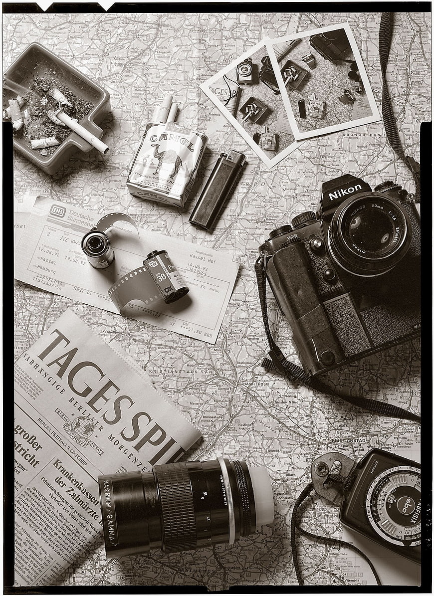 Vintage Nikon Camera and Photography Gear on Map