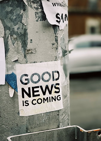 Good News Is Coming Street Poster on Concrete Pole