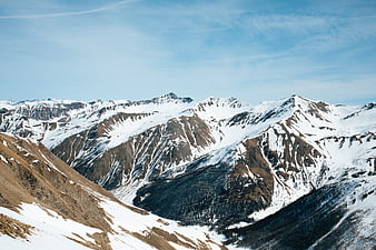 Snow-Capped Mountain Range Under Blue Sky