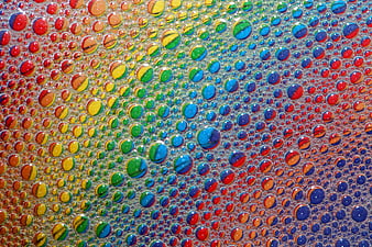 Macro shot of colorful soap bubbles with rainbow reflections