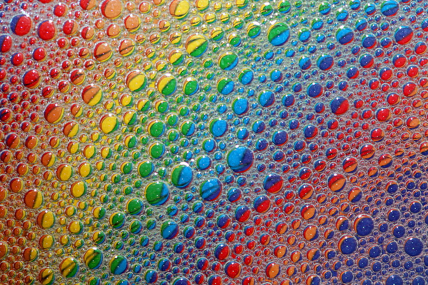 Macro shot of colorful soap bubbles with rainbow reflections