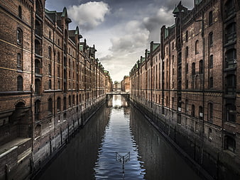 Symmetrical Brick Warehouses Lining a Canal in Hamburg