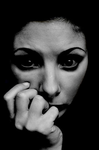 Dramatic Black and White Portrait of Anxious Woman