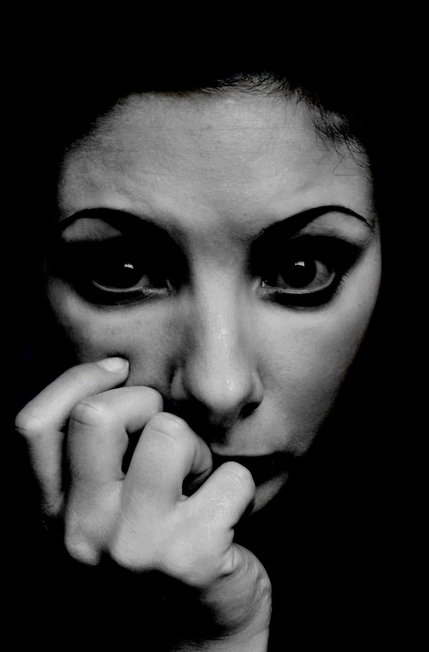 Dramatic Black and White Portrait of Anxious Woman