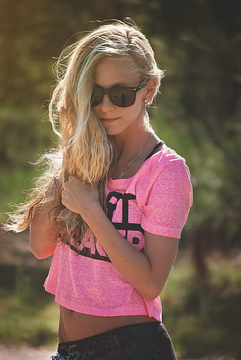 Blonde Woman in Pink Crop Top and Sunglasses Outdoors