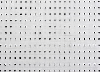 Minimalist White Building Facade with Grid of Square Windows